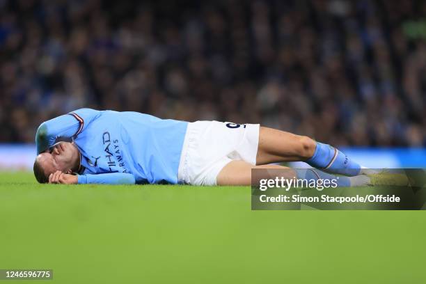 Erling Haaland of Manchester City goes down injured during the Emirates FA Cup Fourth Round match between Manchester City and Arsenal at Etihad...