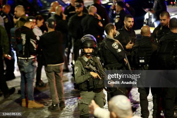 Israeli police investigate the crime scene after 7 people were killed in an armed attack in Jewish settlement at East Jerusalem on January 27, 2023.