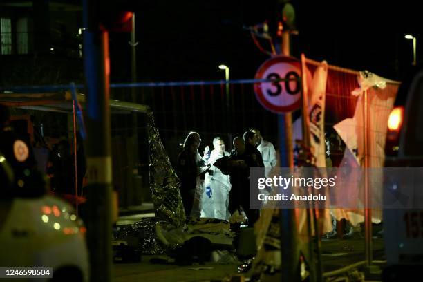 Israeli police investigate the crime scene after 7 people were killed in an armed attack in Jewish settlement at East Jerusalem on January 27, 2023.