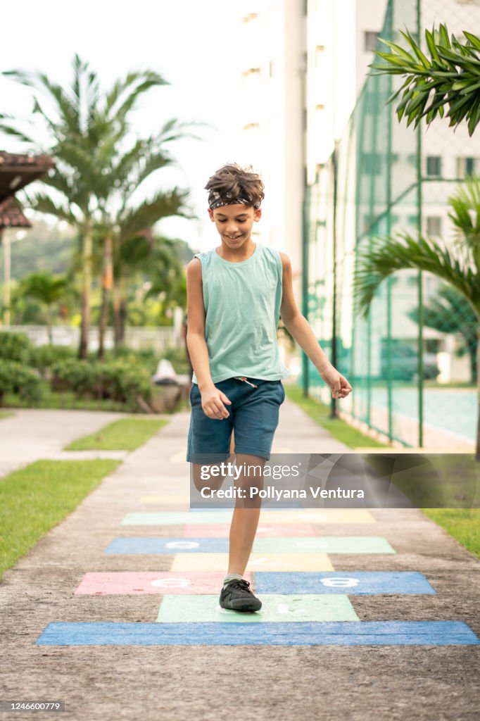 Child playing hopscotch