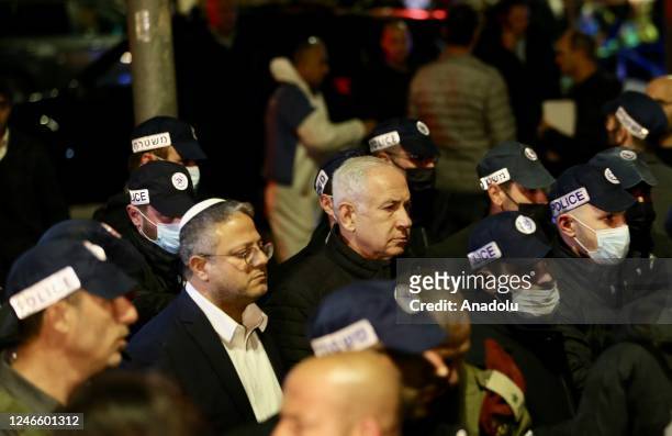 Israeli Prime Minister Benjamin Netanyahu and Israeli National Security Minister Itamar Ben-Gvir investigation the crime scene after 7 people were...
