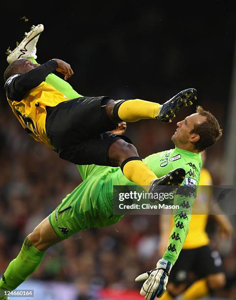 David Hoilett of Blackburn Rovers clashes with Mark Schwarzer of Fulham during the Barclays Premier League match between Fulham and Blackburn Rovers...