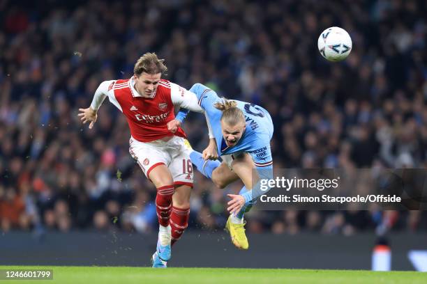 Rob Holding of Arsenal battles with Erling Haaland of Manchester City during the Emirates FA Cup Fourth Round match between Manchester City and...