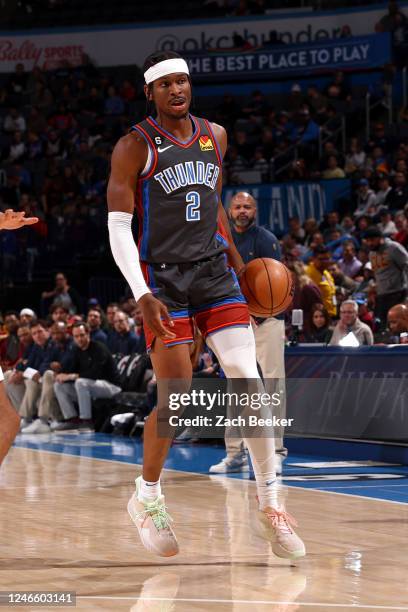 Shai Gilgeous-Alexander of the Oklahoma City Thunder dribbles the ball during the game against the Cleveland Cavaliers on January 27, 2023 at Paycom...