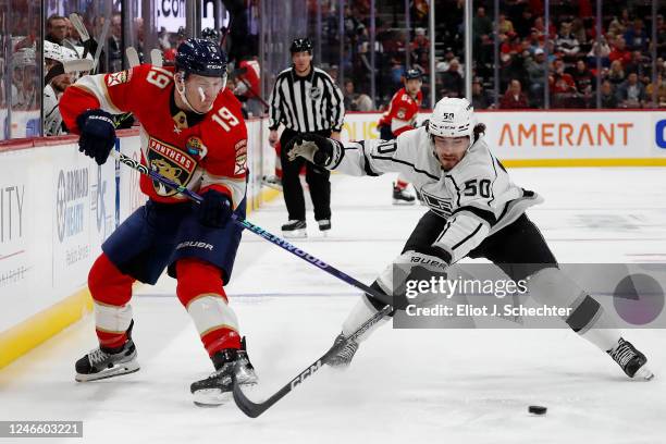 Matthew Tkachuk of the Florida Panthers crosses sticks with Sean Durzi of the Los Angeles Kings at the FLA Live Arena on January 27, 2023 in Sunrise,...