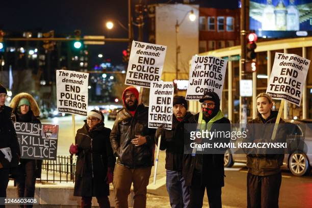 Protesters hold signs as they rally against the fatal police assault of Tyre Nichols, in Chicago, on January 27,2023. - The US city of Memphis...