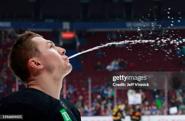 Curtis Lazar of the Vancouver Canucks spits water on the bench before their NHL game against the Columbus Blue Jackets at Rogers Arena January 27,...