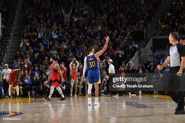 Stephen Curry of the Golden State Warriors encourages the crowd during the final minutes of the game against the Toronto Raptors on January 27, 2023...