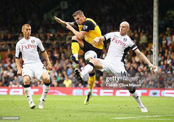 Philippe Senderos of Fulham challenges David Goodwillie of Blackburn Rovers during the Barclays Premier League match between Fulham and Blackburn...