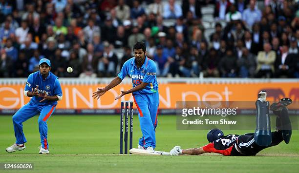Ravi Bopara of England dives into his crease after being sent back by batting partner Graeme Swann during the 4th Natwest One Day International match...