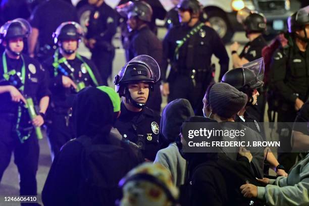 Protesters face off with a line of police officers during a rally against the fatal police assault of Tyre Nichols outside the LAPD headquarters, in...