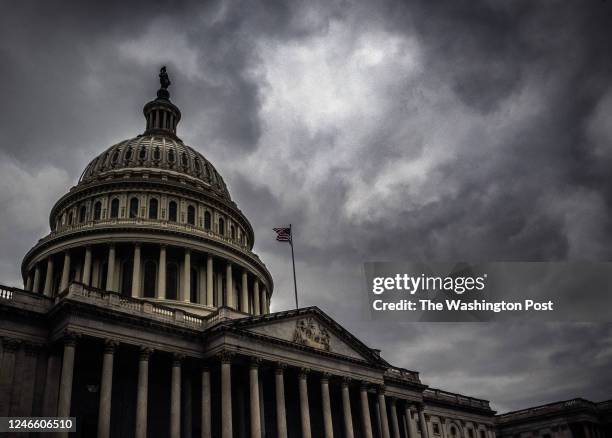 Dramatic clouds over the U.S. Capitol as the Congress faces a debt limit crisis, in Washington, DC.