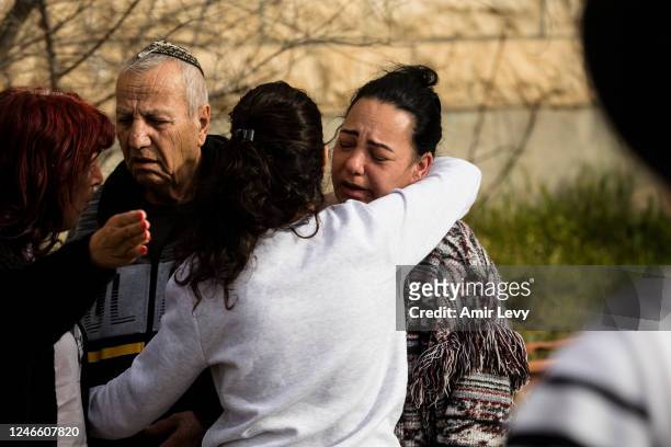 The family of Eli and Natali Mizrahi who died, react at the scene of a mass shooting which happened last night near a synagogue in the neighbourhood...