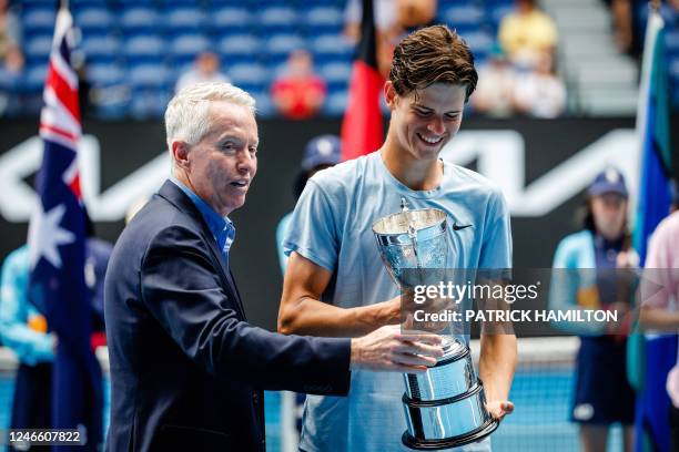 Alexander Blockx celebrates with the trophy after winning a tennis match between Belgian Blockx and American Tien, the final of the junior boys'...