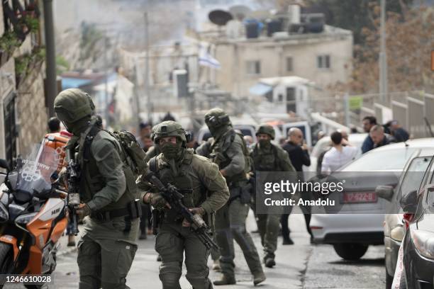 Soldiers patrol as the police take security measurements around the shooting area after two Israeli settlers were injured in a new shooting attack in...