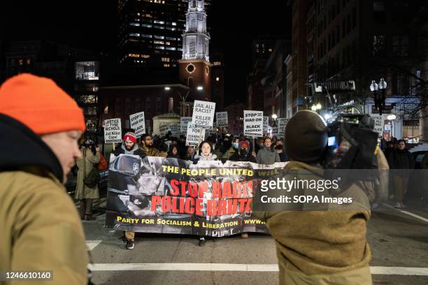 Press member films protesters in Downtown Boston as they demonstrate against the police killing of Tyre Nichols. Around 100 demonstrators gathered at...