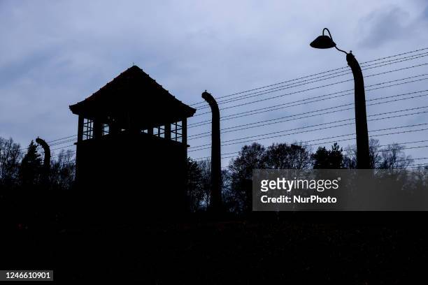 Watchtower and barb wired fence at the former Nazi German concentration and extermination camp Auschwitz Birkenau II during the 78th Anniversary Of...