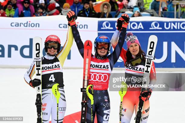 Second placed Germany's Lena Duerr, winner US' Mikaela Shiffrin and third placed Switzerland's Wendy Holdener celebrate after the women's slalom...