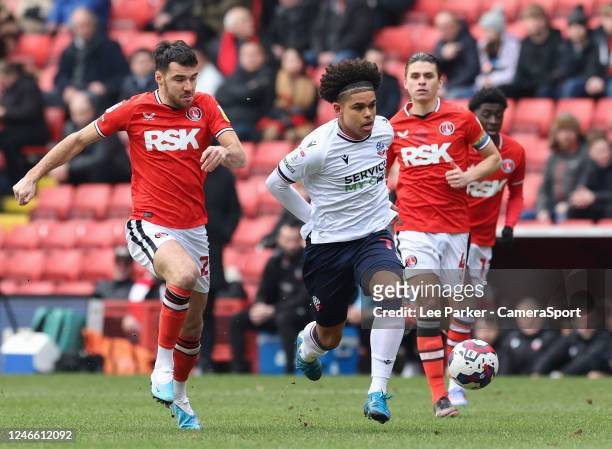 Bolton Wanderers' Shola Shoretire holds off the challenge from Charlton Athletic's Scott Fraser during the Sky Bet League One between Charlton...
