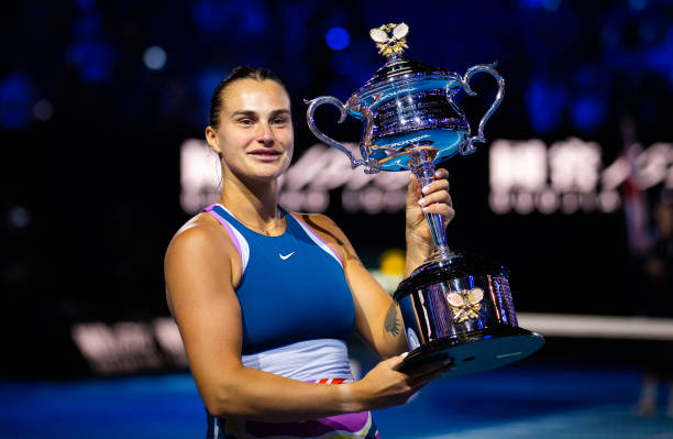 Aryna Sabalenka of Belarus poses with the champions trophy after defeating Elena Rybakina of Kazakhstan in the womens singles final on Day 13 of the...