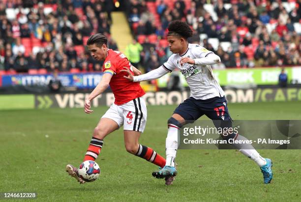 Charlton Athletic's George Dobson and Shola Shoretire battle for the ball during the Sky Bet League One match at The Valley, London. Picture date:...