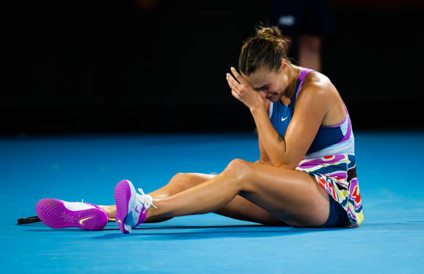 Aryna Sabalenka of Belarus reacts to converting championship point against Elena Rybakina of Kazakhstan in the womens singles final on Day 13 of the...
