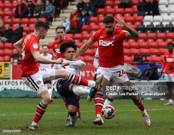 Bolton Wanderers' Shola Shoretire shoots for goal despite the attentions of Charlton Athletic's Ryan Inniss and Lucas Ness but it is saved during the...