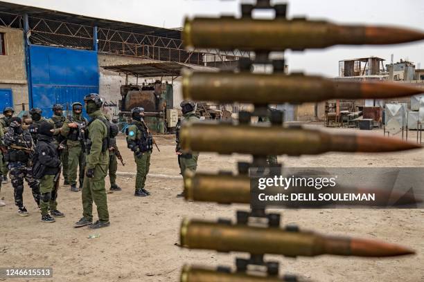 Syrian Kurdish Asayish security forces deploy during a raid against suspected Islamic State group fighters in Raqa, the jihadist group's former...