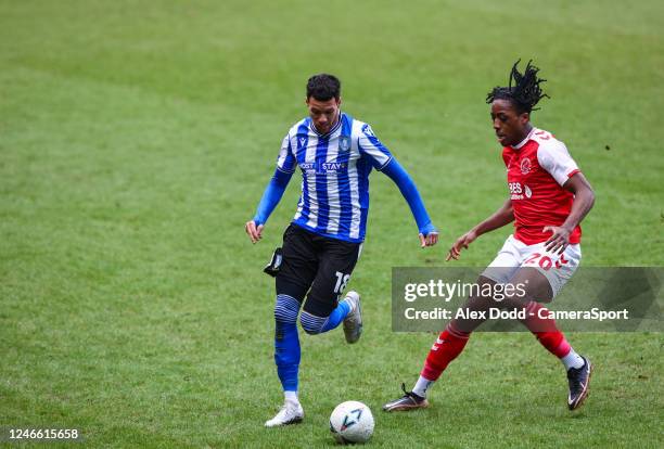 Sheffield Wednesday's Marvin Johnson shields the ball from Fleetwood Town's Promise Omochere during the Emirates FA Cup Fourth Round match between...