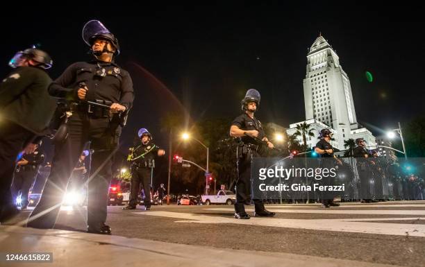 Los Angeles Police officers wearing riot gear near City Hall after crowds became unruly after a vigil for Tyre Nichols near LAPD on January 27, 2023...