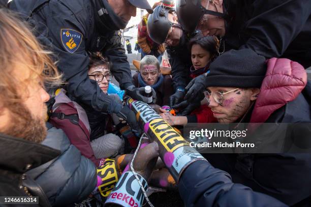 Police are applying acetone to free Extinction Rebellion activists who glued themselves to steel pipes after protesters blocked the A12 motorway on...