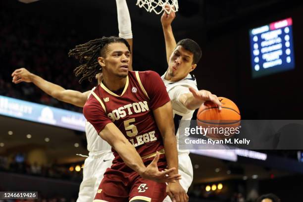 Kadin Shedrick of the Virginia Cavaliers deflects a pass by DeMarr Langford Jr. #5 of the Boston College Eagles in the first half during a game at...