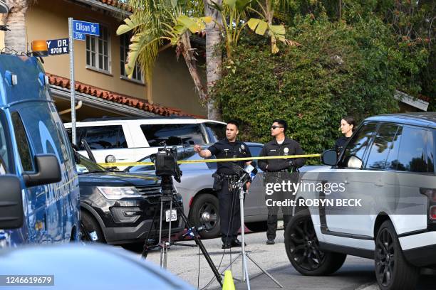 Law enforcement work an investigation after an early morning shooting that left three people dead and four wounded in the Beverly Crest neighborhood...
