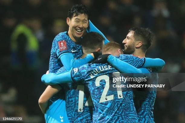 Tottenham Hotspur's South Korean striker Son Heung-Min celebrates with teammates after scoring their second goal during the English FA Cup fourth...