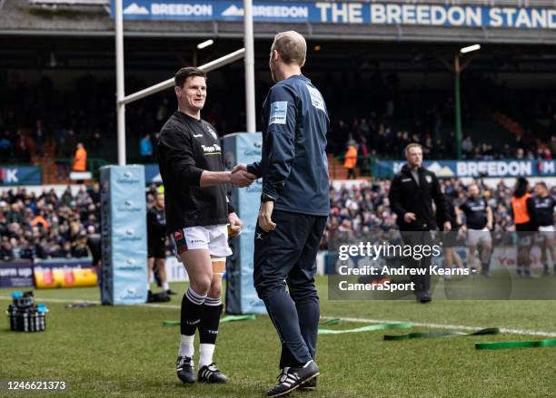 Leicester Tigers Freddie Burns is greeted by referee Wayne Barnes before the match during the Gallagher Premiership Rugby match between Leicester...