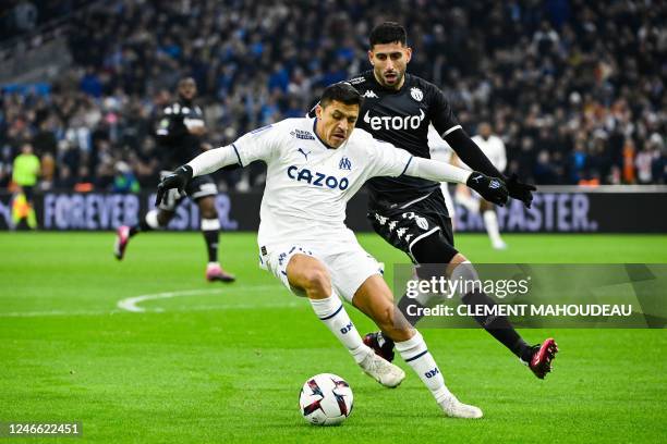 Marseille's Chilean forward Alexis Sanchez fights for the ball with Monaco's Chilean defender Guillermo Maripan during the French L1 football match...