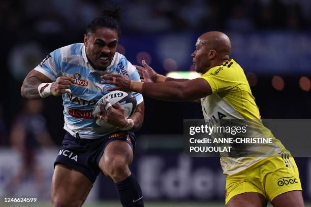 Racing92's New Zealand center Francis Saili vies with La Rochelle's French wing Teddy Thomas during the French Top14 rugby union match between...