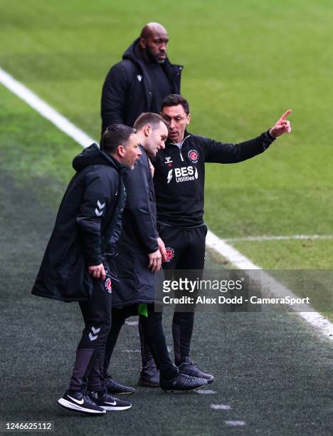 Fleetwood Town head coach Scott Brown has a word with fourth official Benjamin Speedie during the Emirates FA Cup Fourth Round match between...