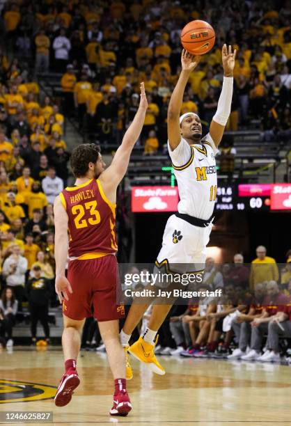 Isiaih Mosley of the Missouri Tigers shoots against Conrad Hawley of the Iowa State Cyclones during the second half of the game at Mizzou Arena on...