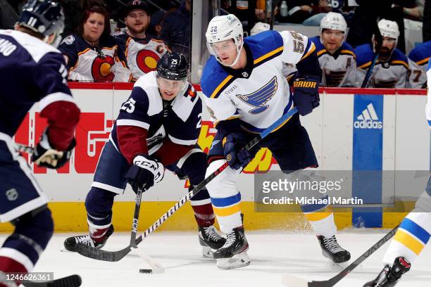 Noel Acciari of the St. Louis Blues skates against Logan O'Connor of the Colorado Avalanche at Ball Arena on January 28, 2023 in Denver, Colorado.