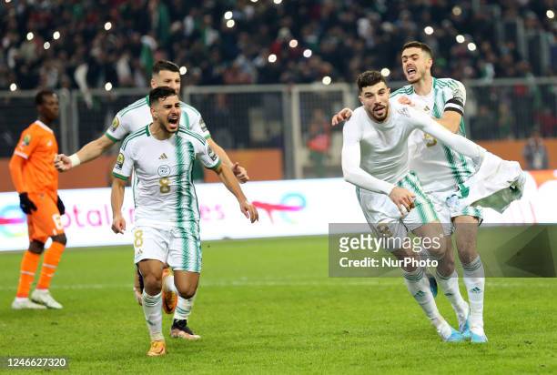 Aymen Mahious of Algeria celebrates with teammates after scoring during the quarterfinal match of the 7th African Nations Championship between...