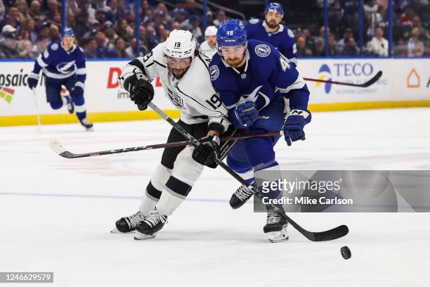 Nick Perbix of the Tampa Bay Lightning skates against Alex Iafallo of the Los Angeles Kings during the second period at Amalie Arena on January 28,...