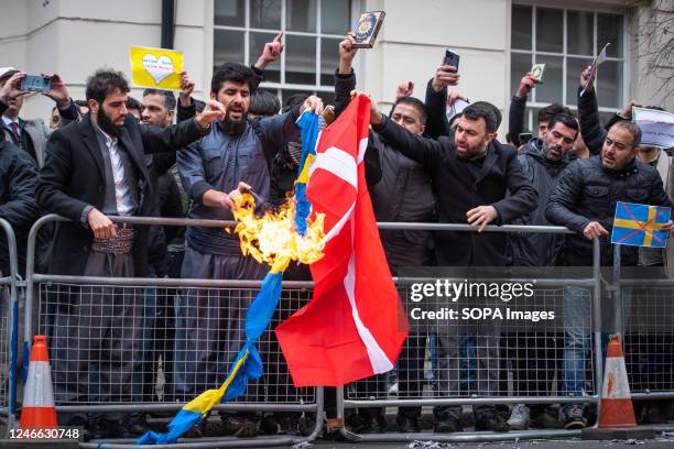 Protestors burn the Swedish and Danish flags during the demonstration against the Quran Burning In Sweden. A high representative of the United...