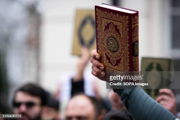 Protestor holds the Quran during the demonstration against the Quran Burning In Sweden. A high representative of the United Nations Alliance of...