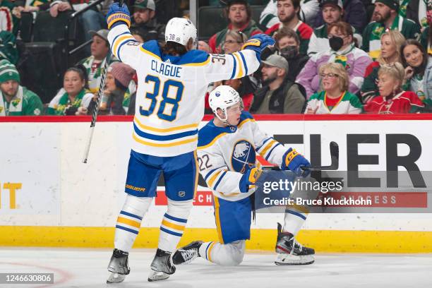 Jack Quinn celebrates his goal with his teammate Kale Clague of the Buffalo Sabres against the Minnesota Wild during the game at the Xcel Energy...