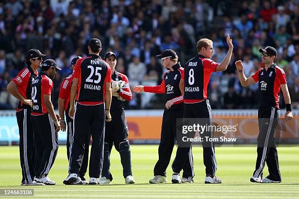 Stuart Broad of England celebrates with his team mates after trapping Rajinkya Rahane of India lbw during the 4th Natwest One Day International match...