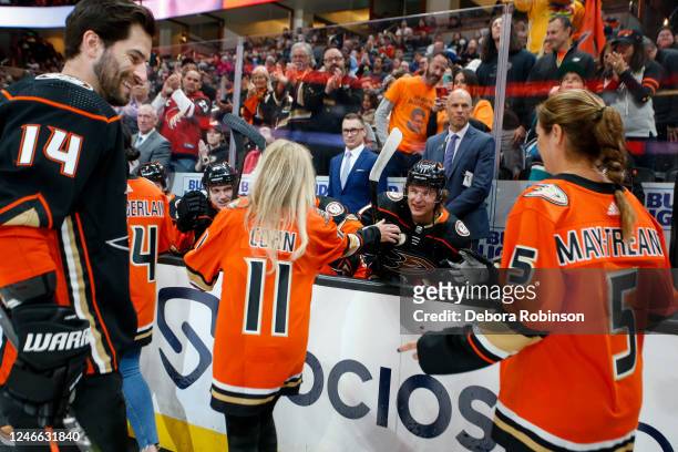 Linda Cohn and Misty May-Treanor high five Anaheim Ducks during the Women in Sports Night prior to the game between the Arizona Coyotes and the...