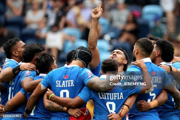 Samoa players huddle for their match between Australia and Samoa during the World Rugby Sevens series match at the Allianz Stadium in Sydney on...