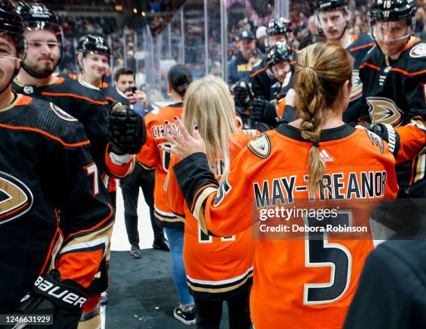 Linda Cohn and Misty May-Treanor high five Anaheim Ducks during the Women in Sports Night prior to the game between the Arizona Coyotes and the...