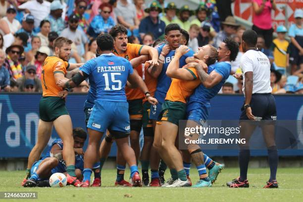 Australia and Samoa teams scuffle at full time in their match during the World Rugby Sevens series match at the Allianz Stadium in Sydney on January...